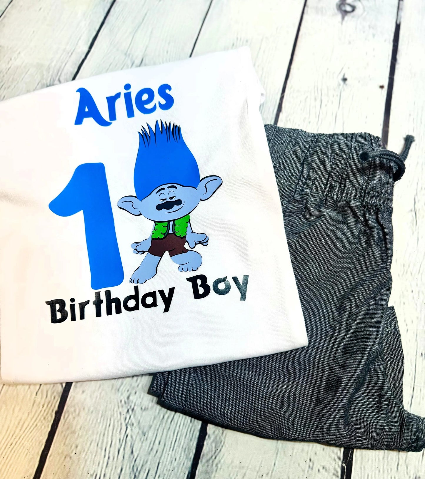 Personalized blue-haired troll birthday shirt, First birthday outfit for boys with troll theme, Custom troll party shirt with name and age, Blue and green troll birthday tee for toddlers, Funny character-inspired birthday shirt for kids